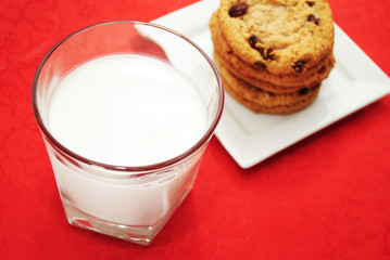 Glass of Cold Milk with Cookies in the Background
