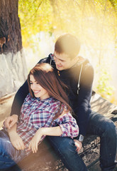 Young beautiful couple in spring blossoms