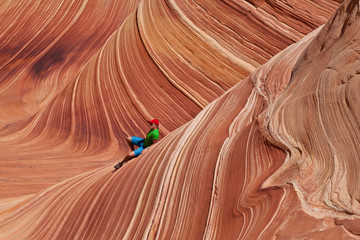 USA - man in coyote buttes recreational park - The wave