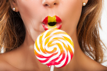 Sexy woman with a lollypop
