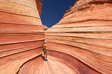 USA - girl in the Coyote buttes recreational park - The wave