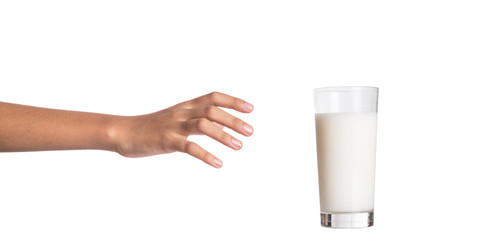 Young girl hand with a glass of milk - 70305280