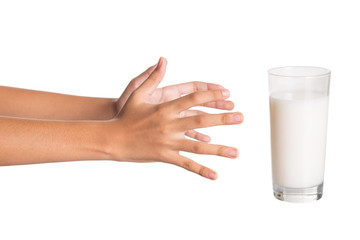 Young girl hand with a glass of milk