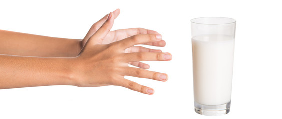 Young girl hand with a glass of milk