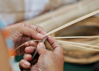 Hand slicling dried bamboo