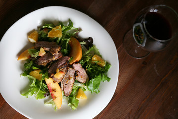 Salad with roasted duck breast and orange