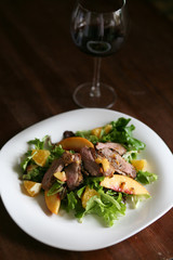 Salad with roasted duck breast and orange