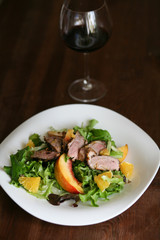 Salad with roasted duck breast and orange