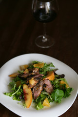 Salad with roasted duck breast and orange