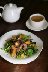 Salad with roasted duck breast and orange