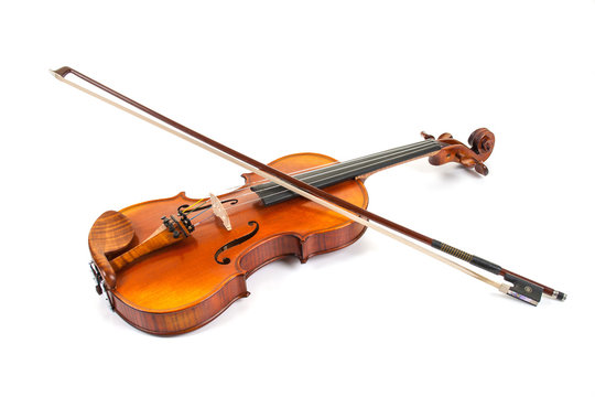 Violin and bow on white surface