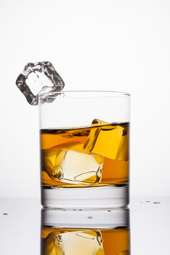 Whisky in glass on a white background