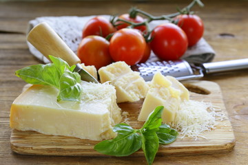 fresh tasty hard parmesan cheese on a wooden board