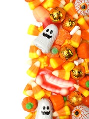 Halloween candy vertical border over a white background