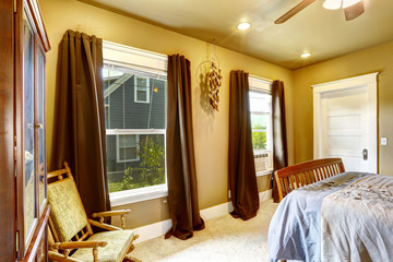 Warm tones bedroom with brown curtains