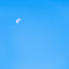 moon in clear blue autumn morning sky