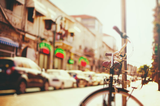 Blurred image of city street with bicycle