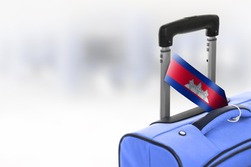 Destination Cambodia. Blue suitcase with flag.