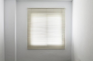 Venetian blinds in a white empty room