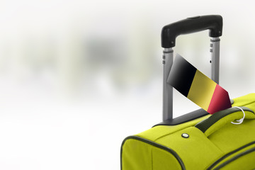 Destination Belgium. Green suitcase with flag.