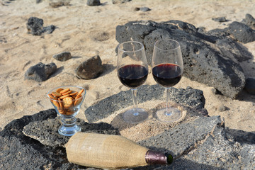 Two Wine Glasses And Bottle On The Beach With Sea Background