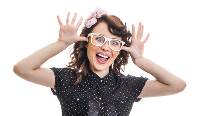 Playful young woman sticking her tongue out