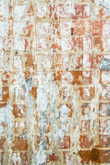Background of old wall of red brick with clay masonry scuffed