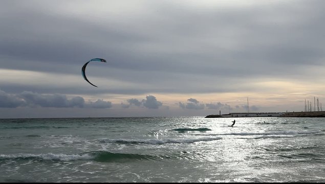 seaside ocean clouds waves and a kitesurfer