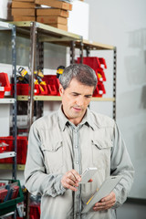 Man Scanning Product In Hardware Store