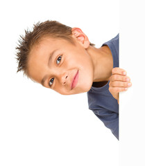 Little boy is looking out from the blank banner