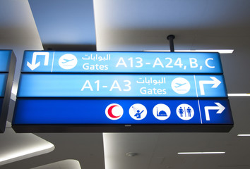 Airport  sign board with icons of gates, rest and praying rooms