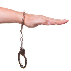 male hand in police handcuffs showing gesture isolated