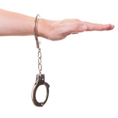 male hand in police handcuffs showing gesture isolated