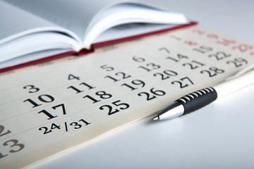 calendar days with numbers and pen