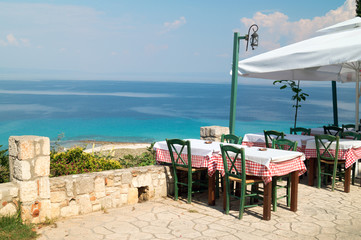 Traditional Greek table at the beach in Greece - 70318859