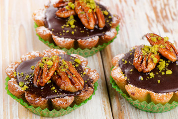 Sweet Chocolate Cupcakes on a wooden table.