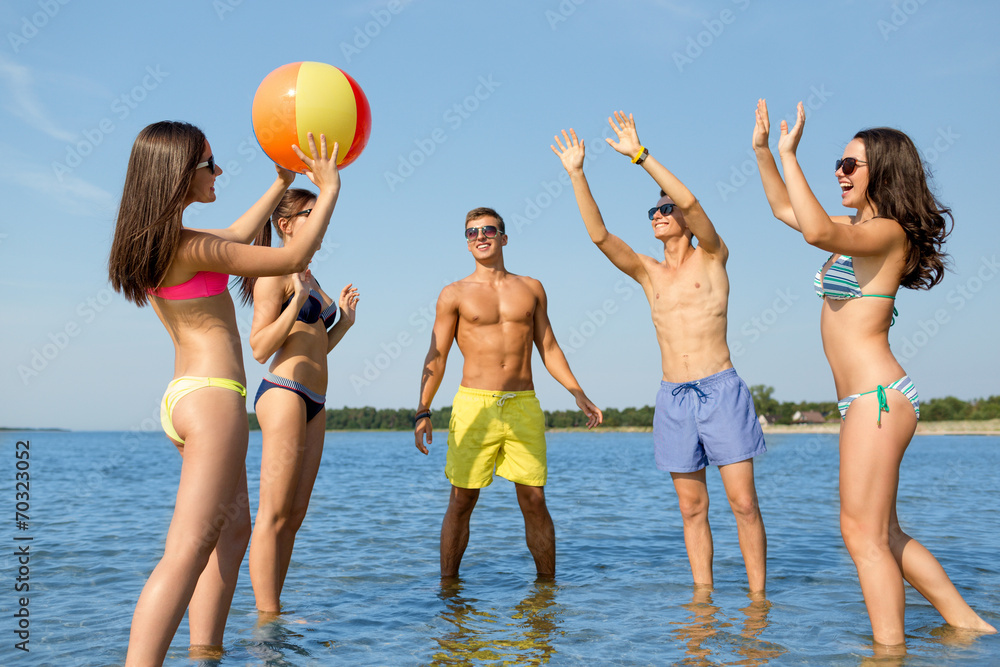 Sticker smiling friends in sunglasses on summer beach