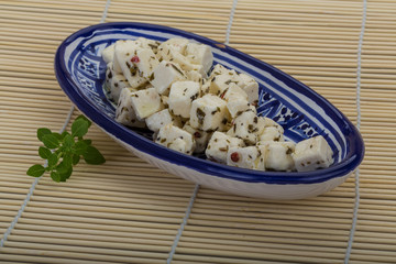 Cheese with spices and oil