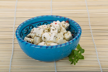 Cheese with spices and oil