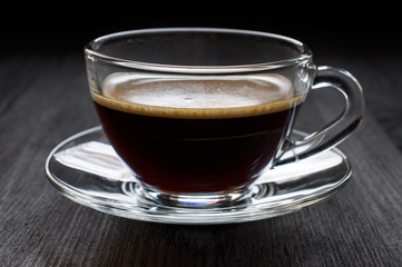 Black hot coffee in a glass cup