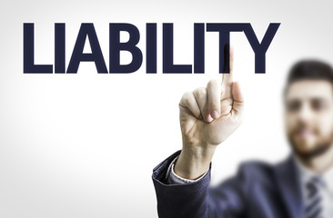 Business man pointing to transparent board with text: Liability