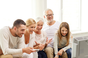 happy family watching tv at home