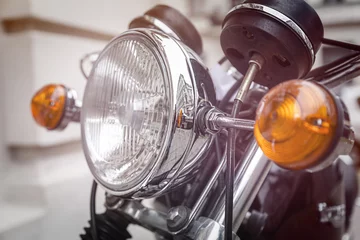 Fototapete close up of a motorcycle headlight with blinker light © Armin Staudt