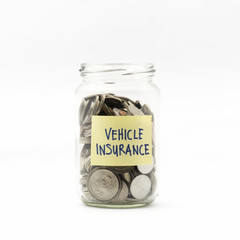 Isolated coins in jar with vehicle insurance label - financial c