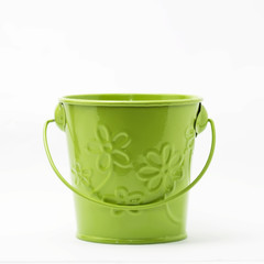 Small green colored empty bucket isolated in white