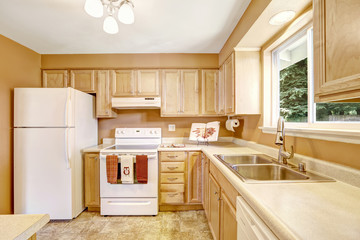 New kitchen cabinets with white appliances