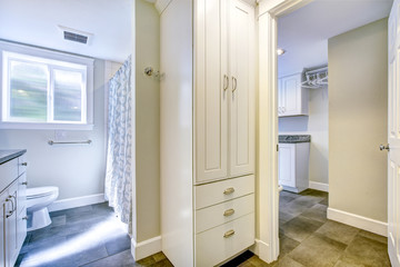 Spacious bathroom with white cabinet