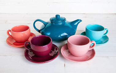 teapot and cup on a wooden tray