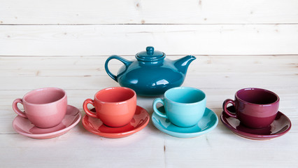 teapot and cup on a wooden tray