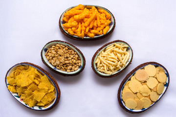 Snacks on ceramic and rattan fancy platter from top view